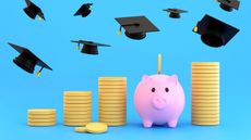 Stacks of coins and piggy bank for college students with graduation caps